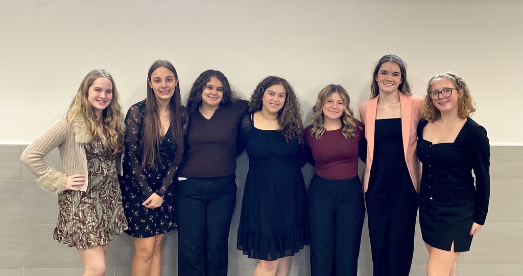 seven students dressed to compete in Prose and Poetry