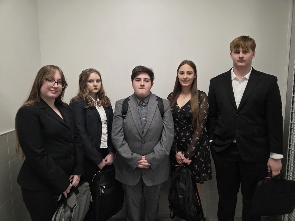 five students dressed to compete in extemp