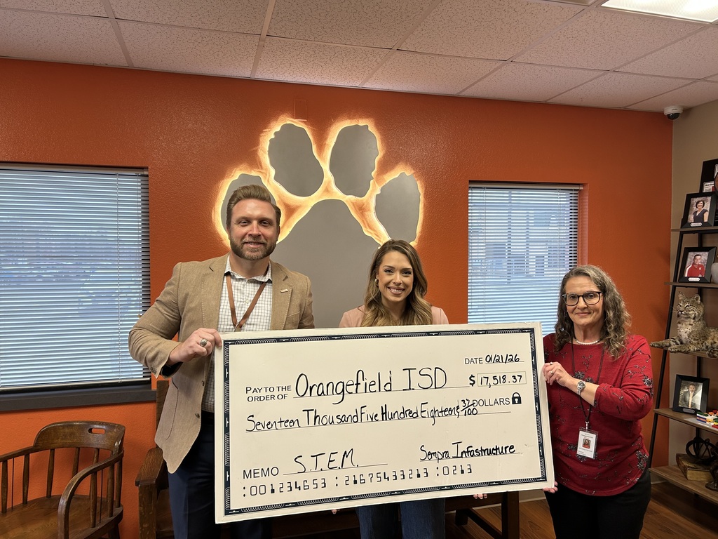 School Superintendent and grant writer with Sempra rep holding check.