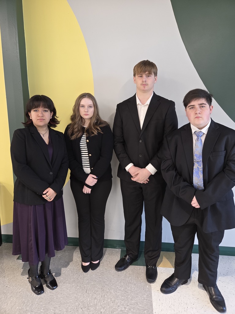 four debaters dressed to compete