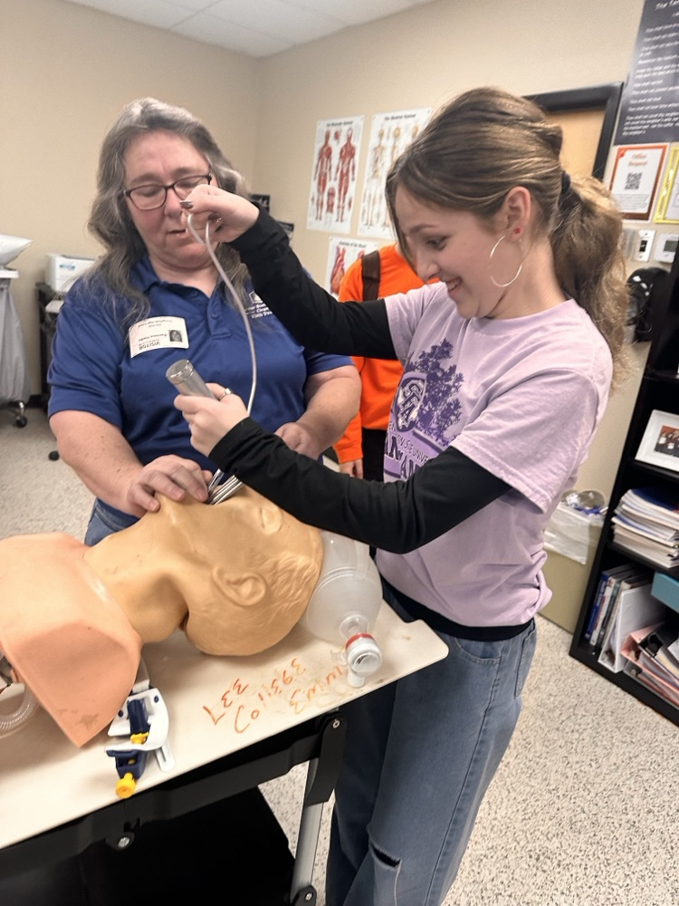 student working on a mannequin