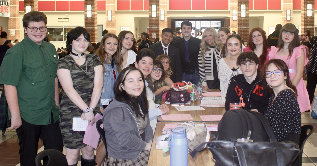 competitors gathered around a table
