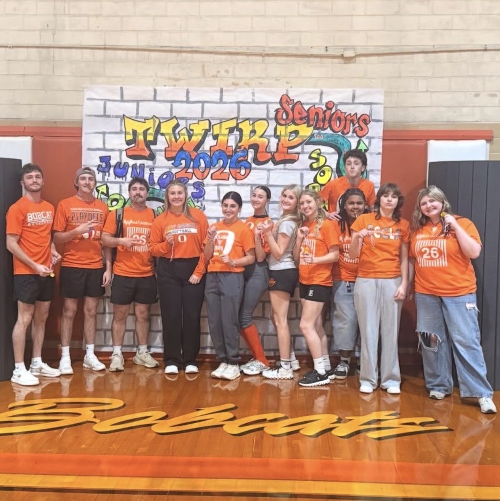 senior participants in orange shirts