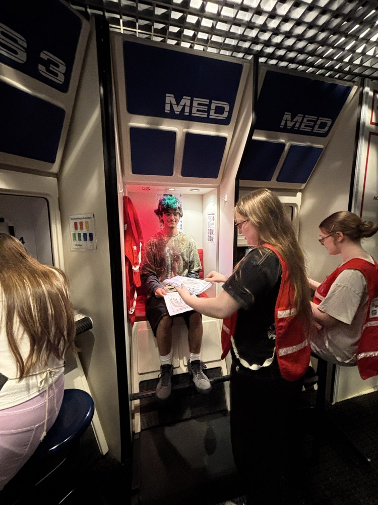 students working on stations in the mission