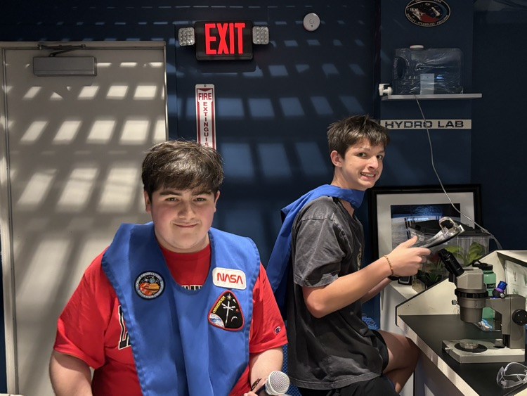 students at their station during the mission