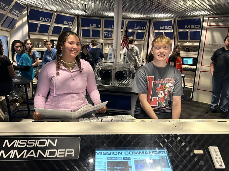 students sitting at data entry station