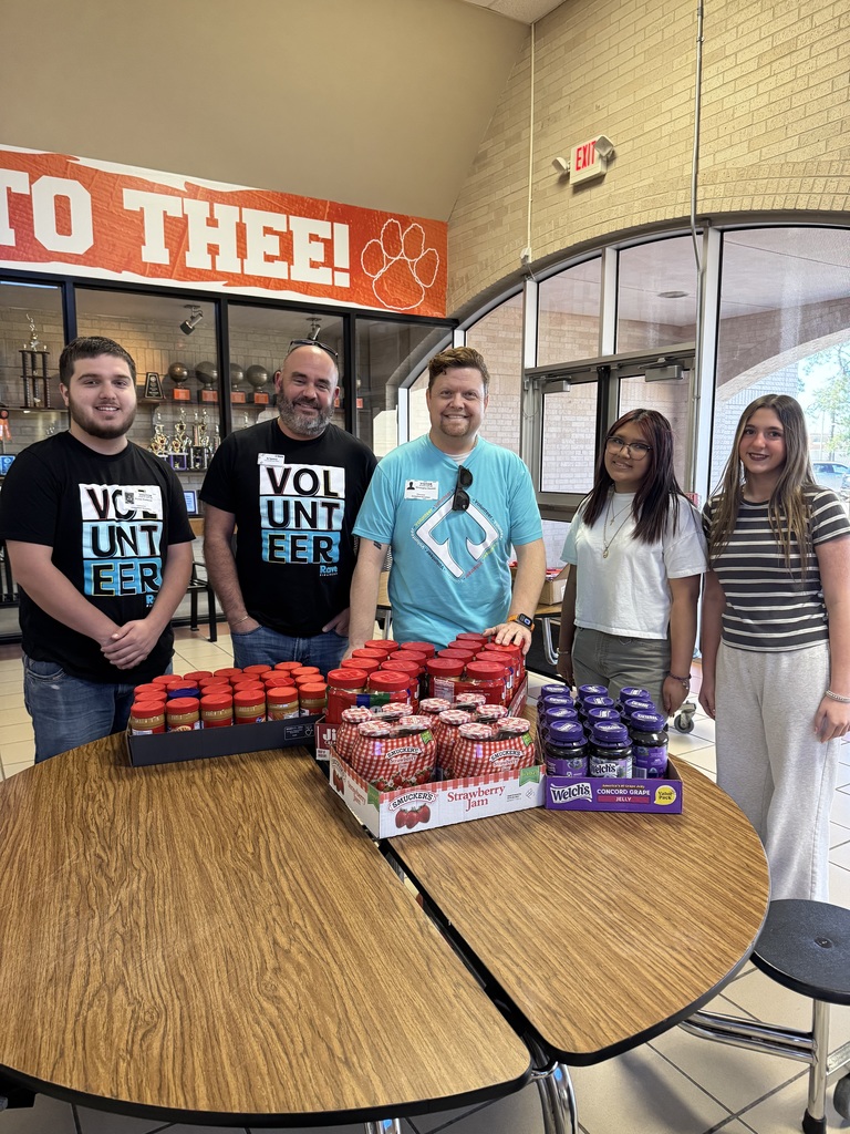 OJH students and Lions Club members pose with the peanut butter and jelly donation for the Orange Lions Club.