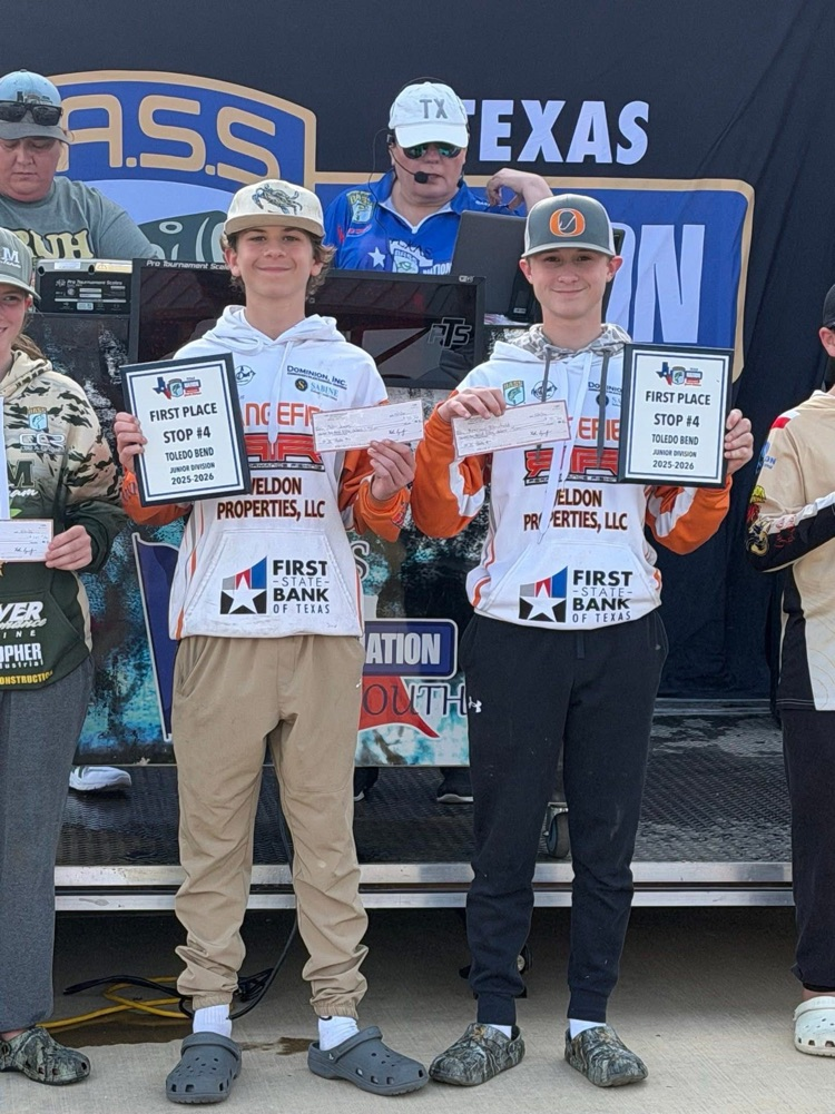 Collin and Brennon pose with their tournament winnings.