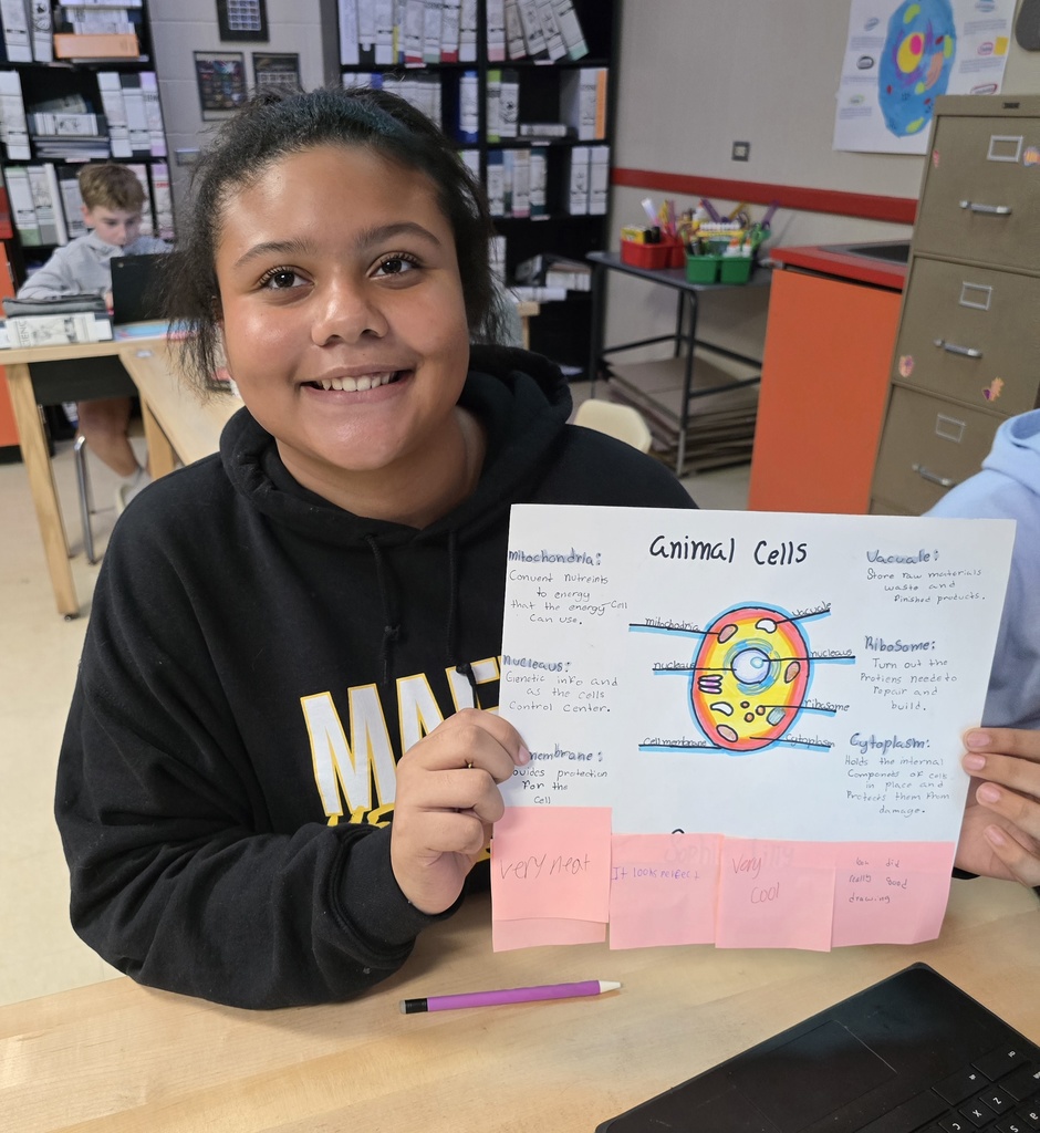 8th grade student posing with their science project.