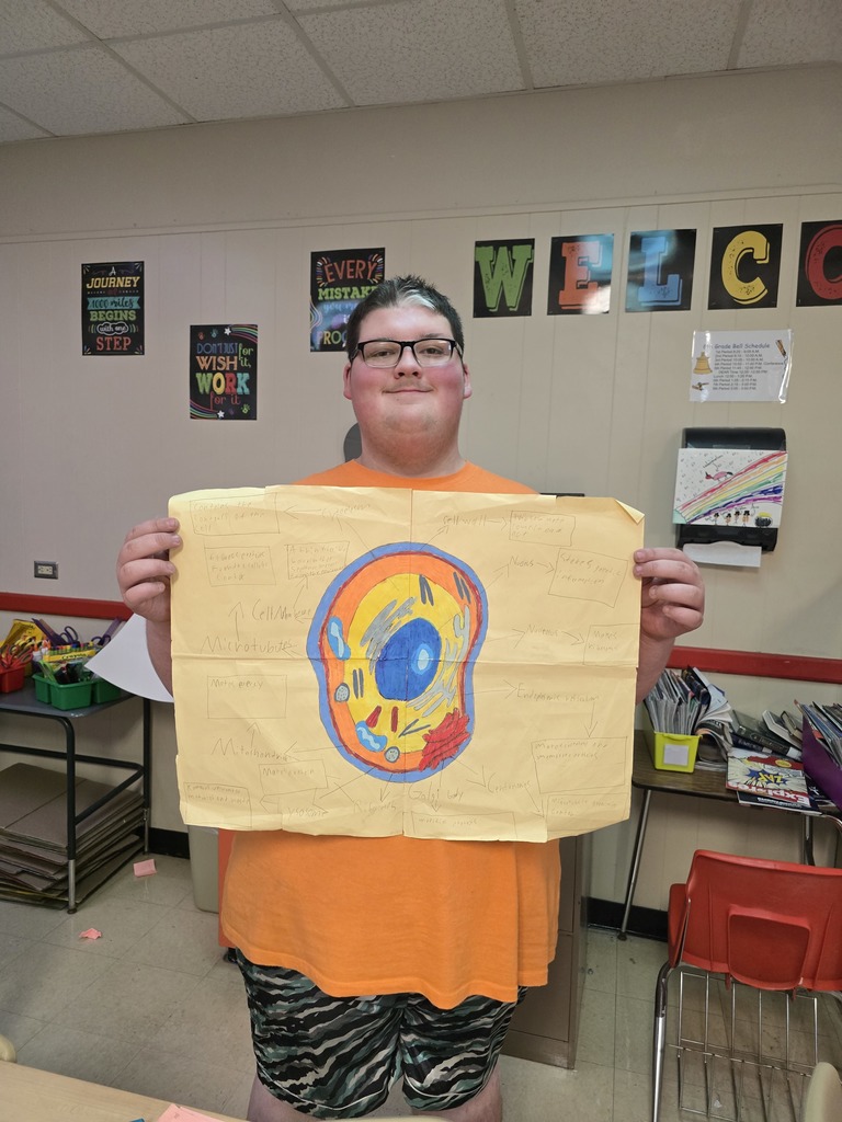 8th grade student posing with their science project.