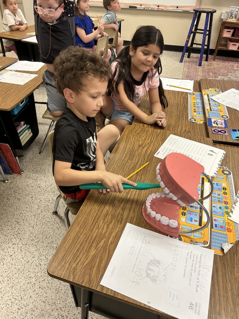 Dentist with Teeth and students