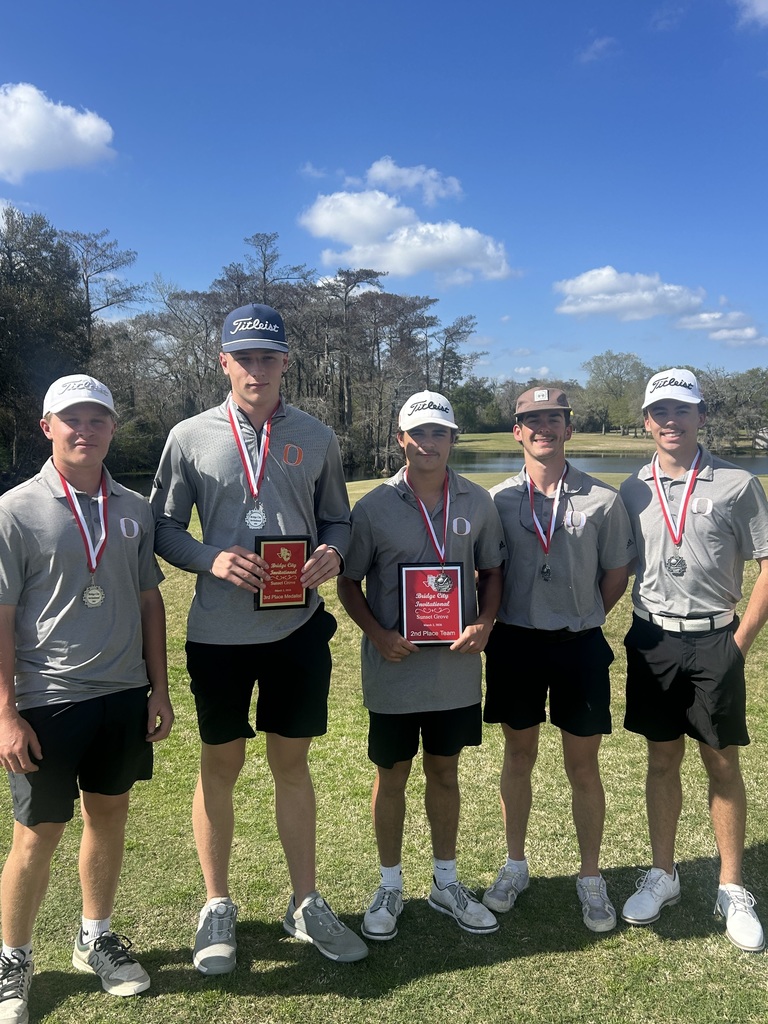 Five golfers in matching shirts and shorts pose for a photo. They each hold medals and certificates.