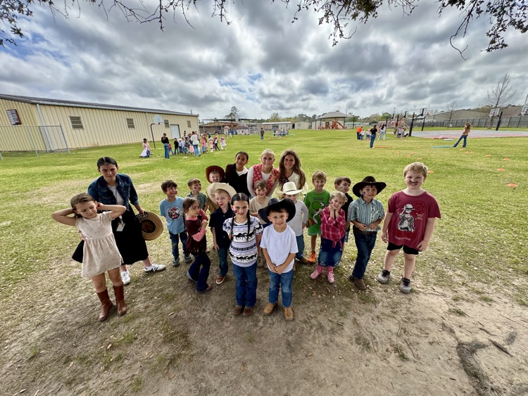 Children outside in rodeo apparel  
