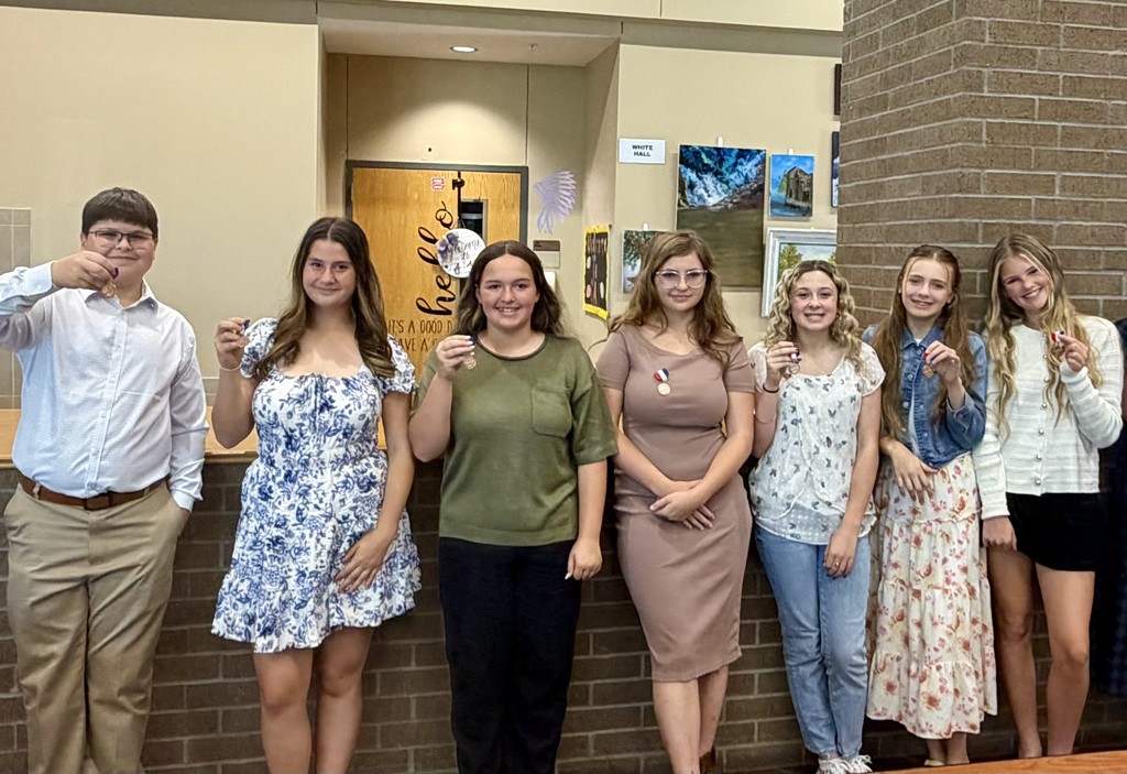 OJH Choir posing for a picture with their medals.