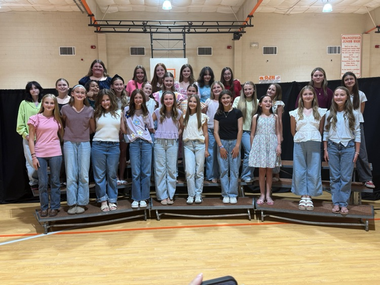 Choir students pose for a group photo.