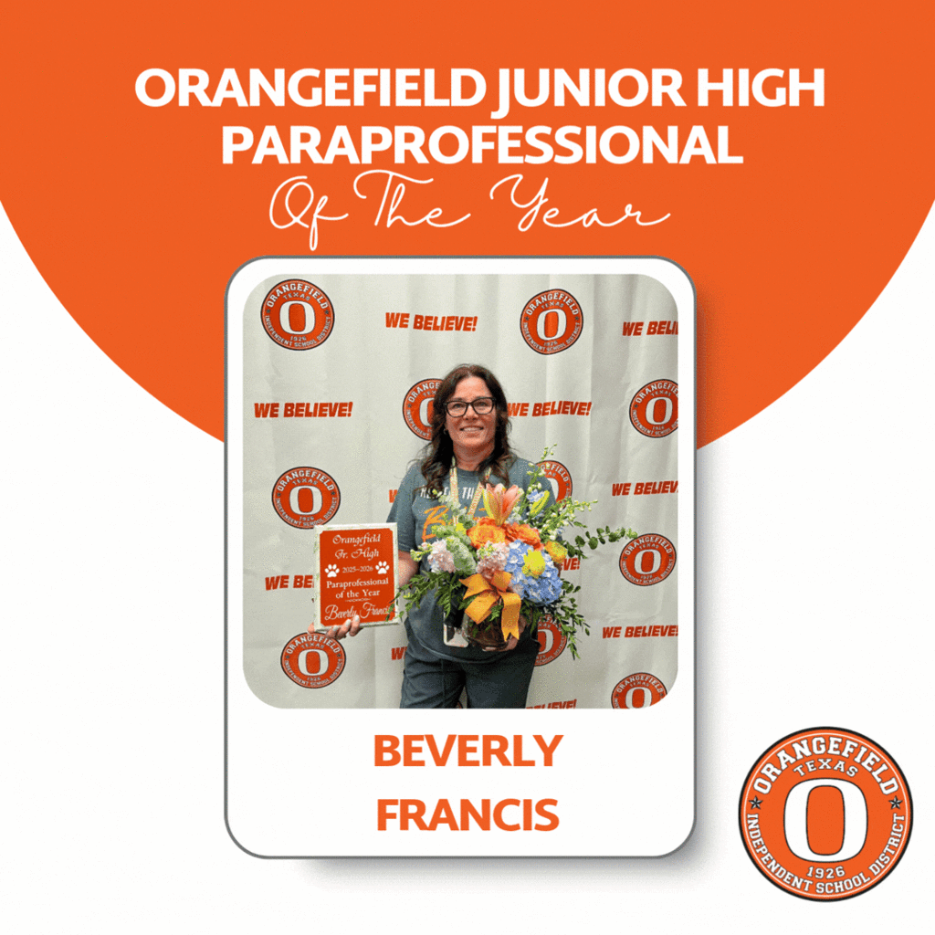 A certificate presentation for Beverly Francis. She holds flowers and the award, standing in front of a white backdrop.