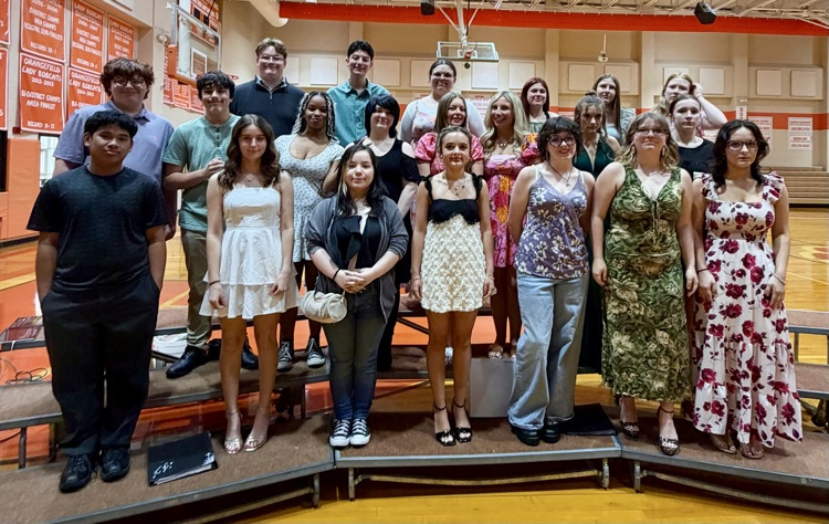 Students on risers dressed to perform  