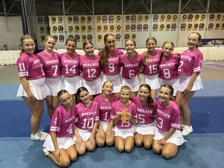 OJH Cheer Team pose for a group photo with their awards.