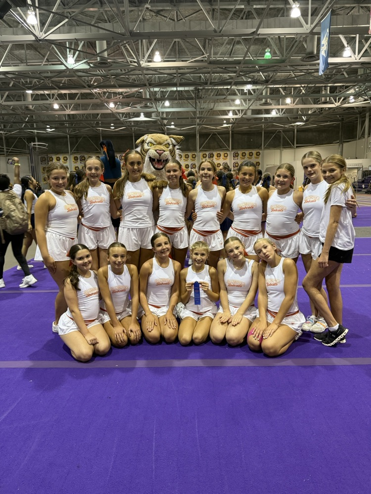 OJH Cheer Team pose for a group photo with their awards.