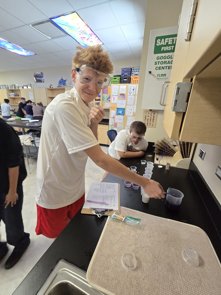 OJH 8th graders participating in an exciting science experiment.