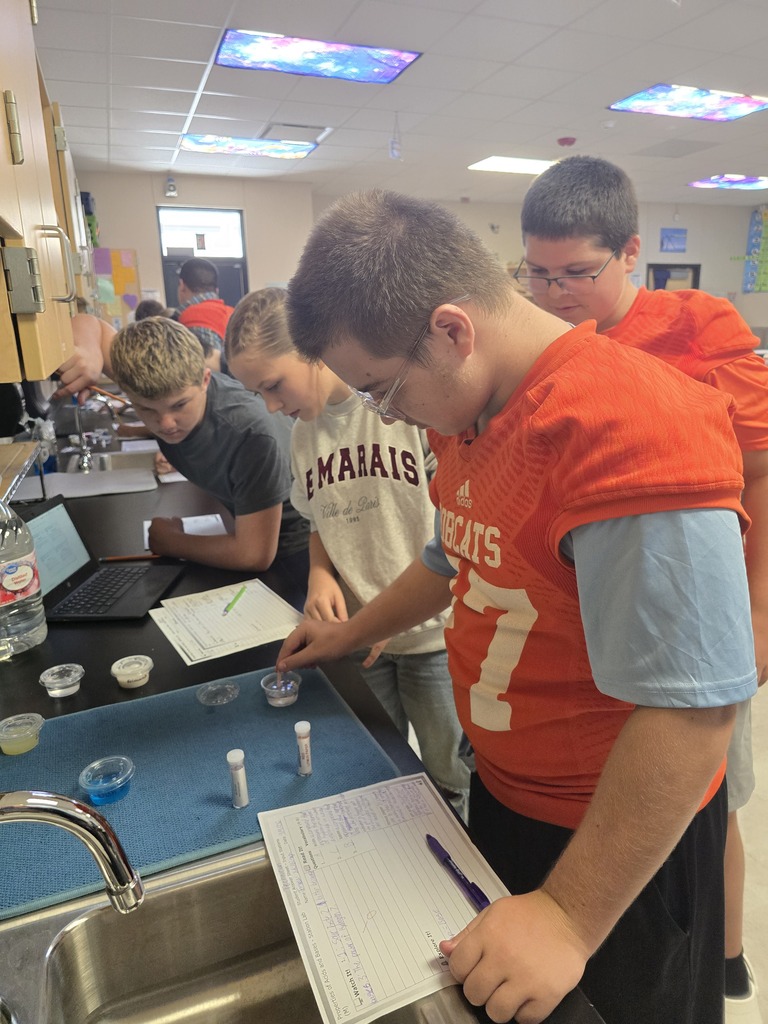 OJH 8th graders participating in an exciting science experiment.