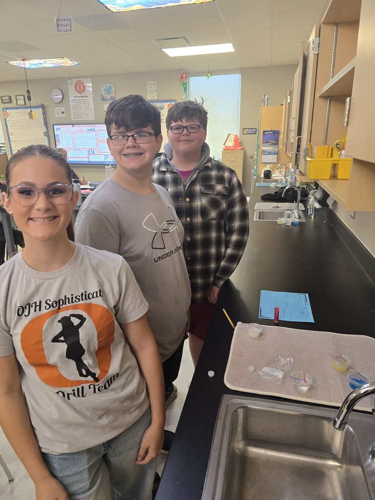 OJH 8th graders participating in an exciting science experiment.