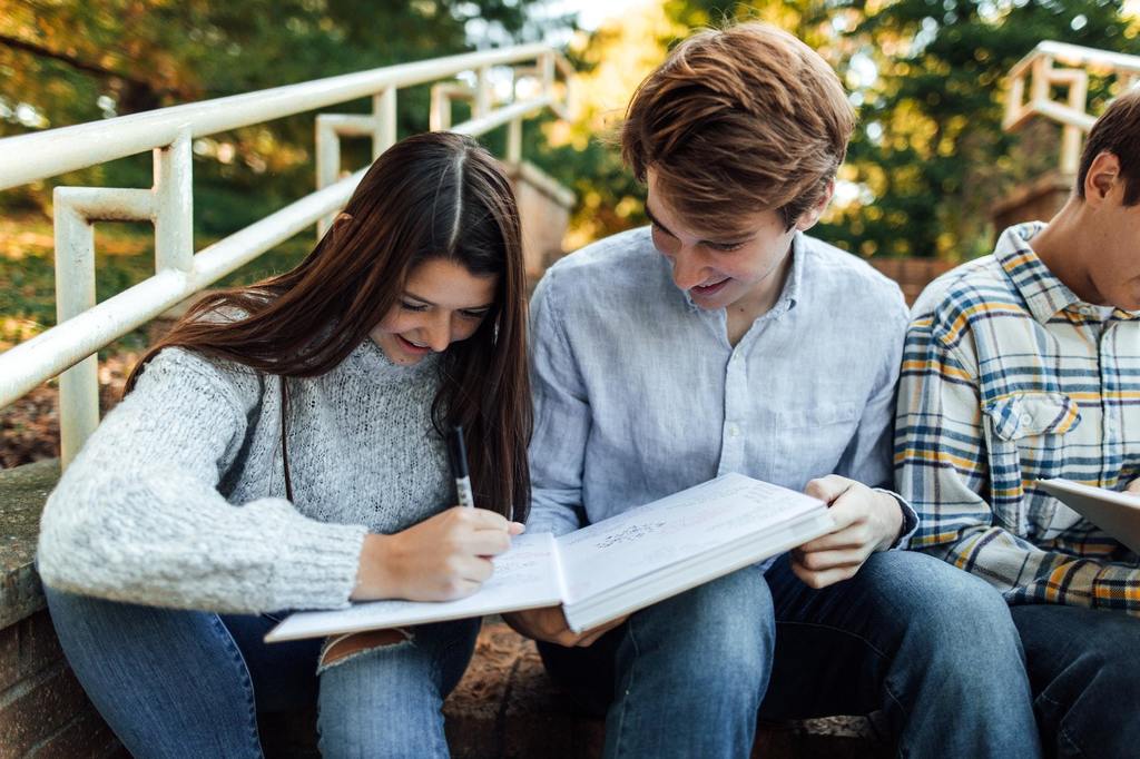 Two students signing a yearbook