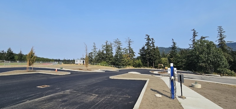 Images of new asphalt and inviting people to ribbon cutting ceremony