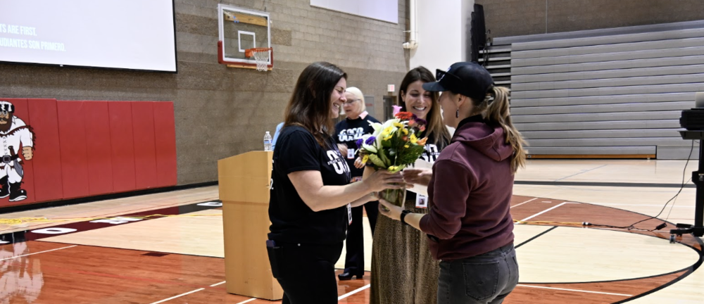 Juliana walking up to get award and flowes