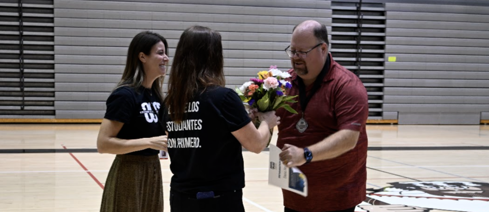 group of award winners with flowers