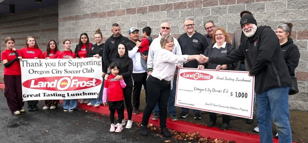 group of people holding a scholarship