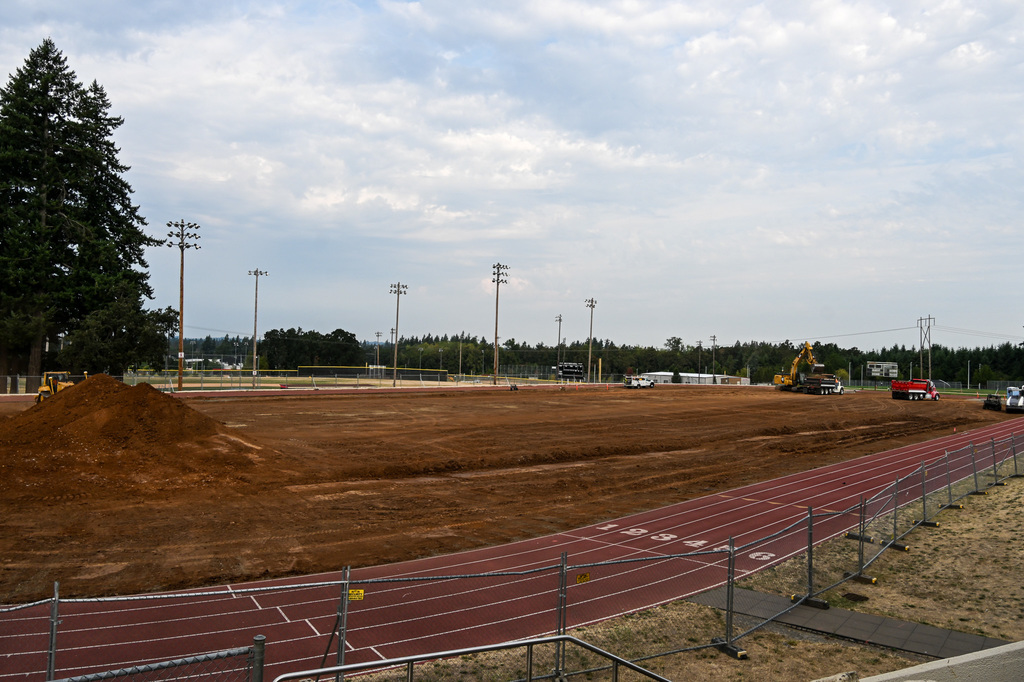 Trucks removing turf from OCHS field