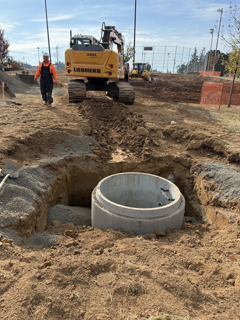 Construction site, large concrete tunnel in ground