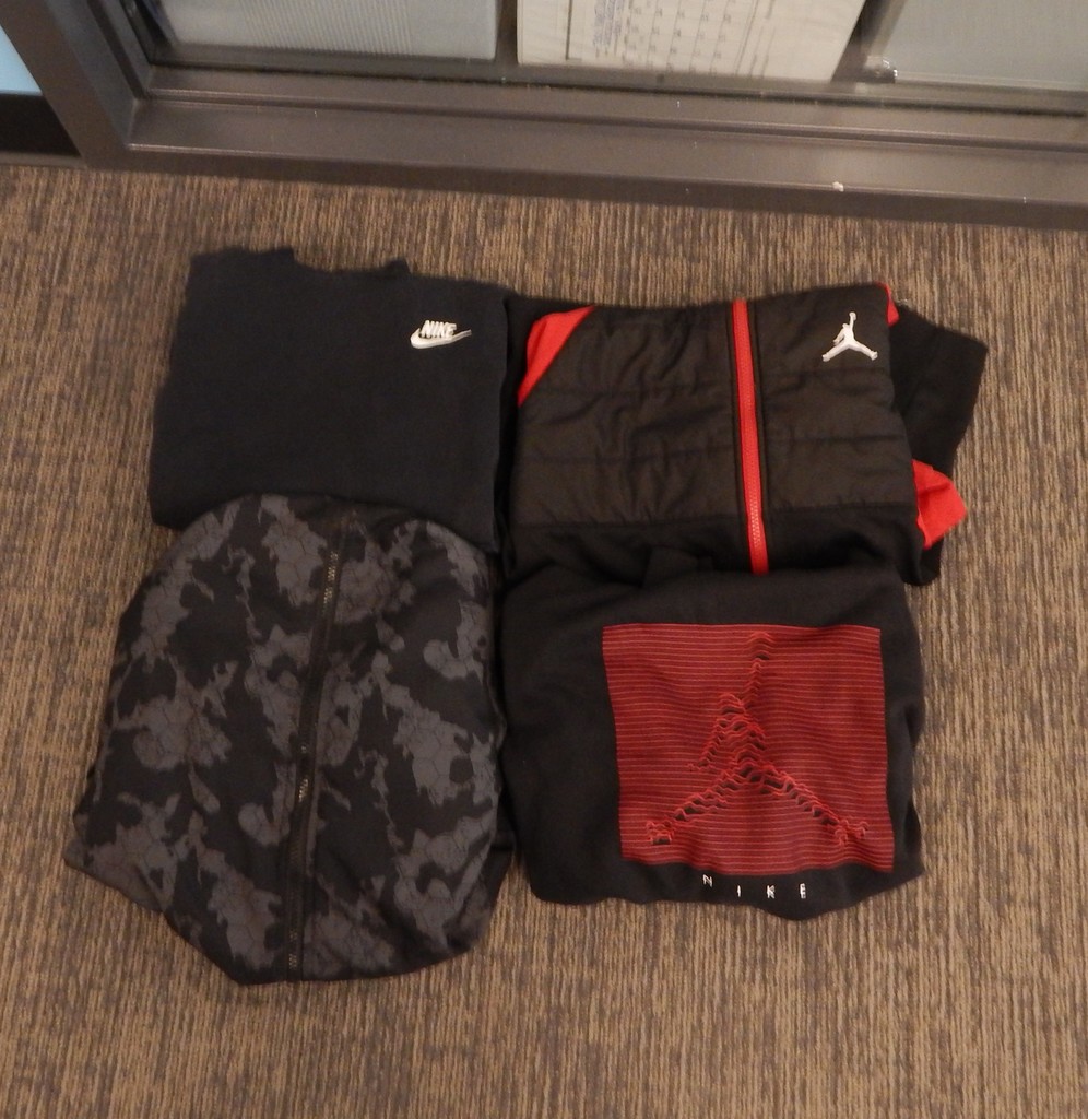 Four jackets/sweatshirts - 2 jordan, 1 black Nike, 1 camouflage