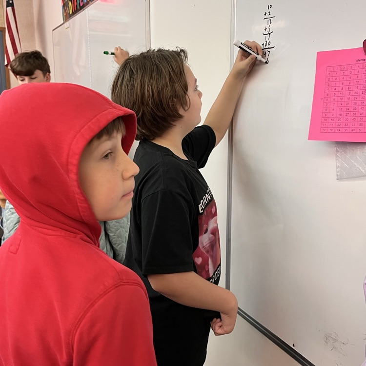 students play a math game