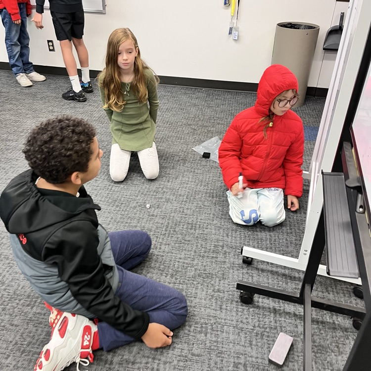 students play a math game