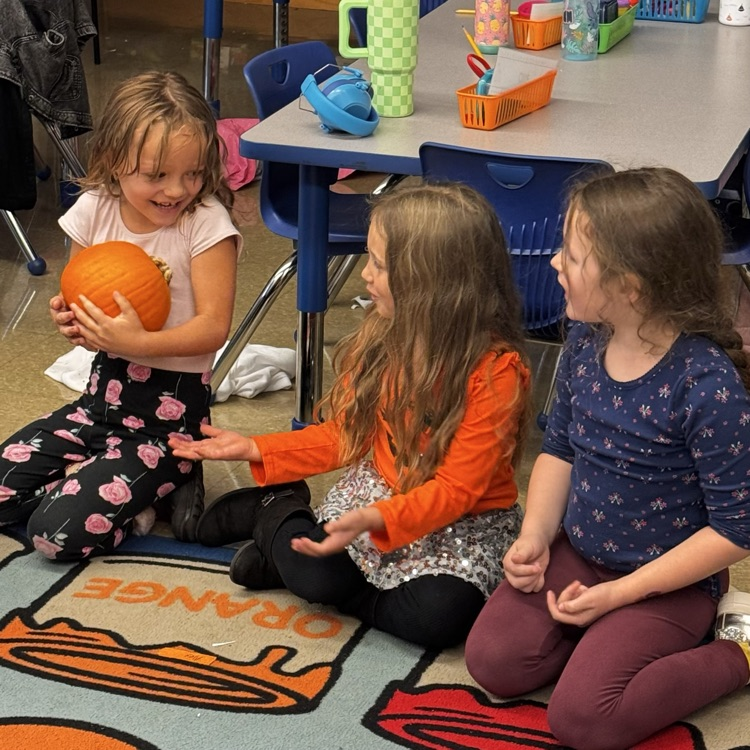 Kindergartners with a pumpkin 