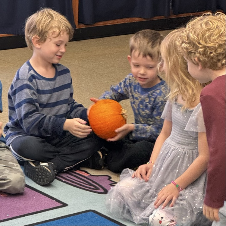 Kindergartners with a pumpkin 