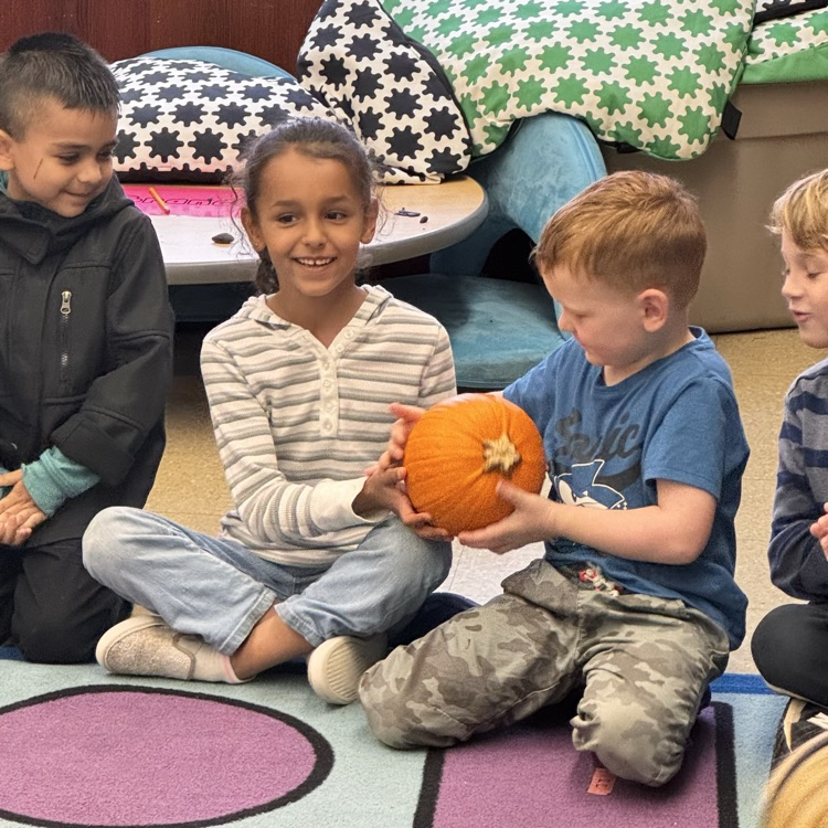 Kindergartners with a pumpkin 