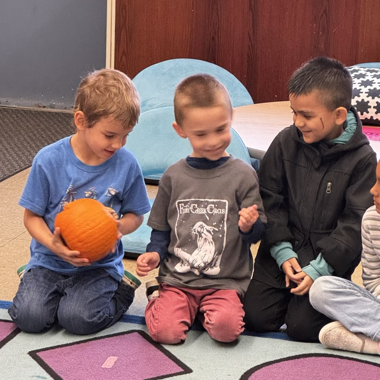 Kindergartners with a pumpkin 