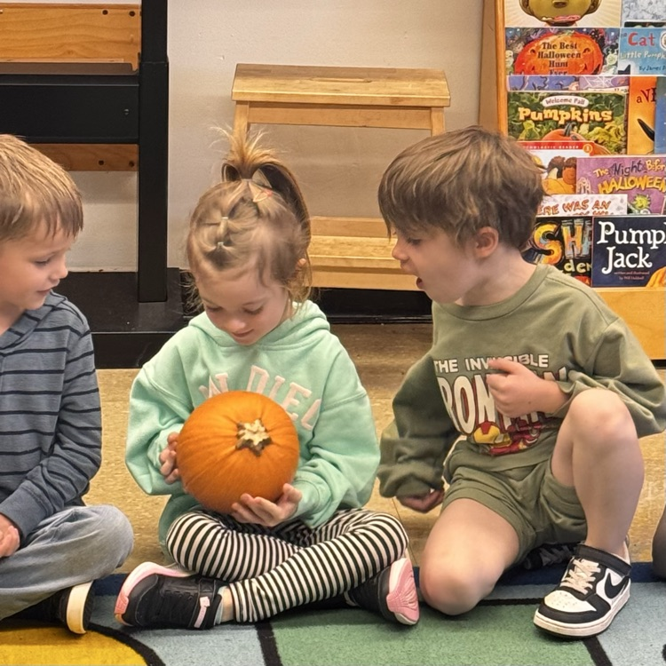 Kindergartners with a pumpkin 