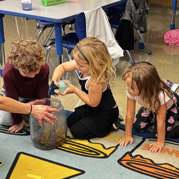 Kindergartners with a pumpkin 