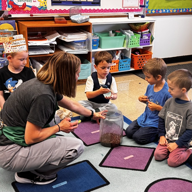 Kindergartners with a pumpkin 