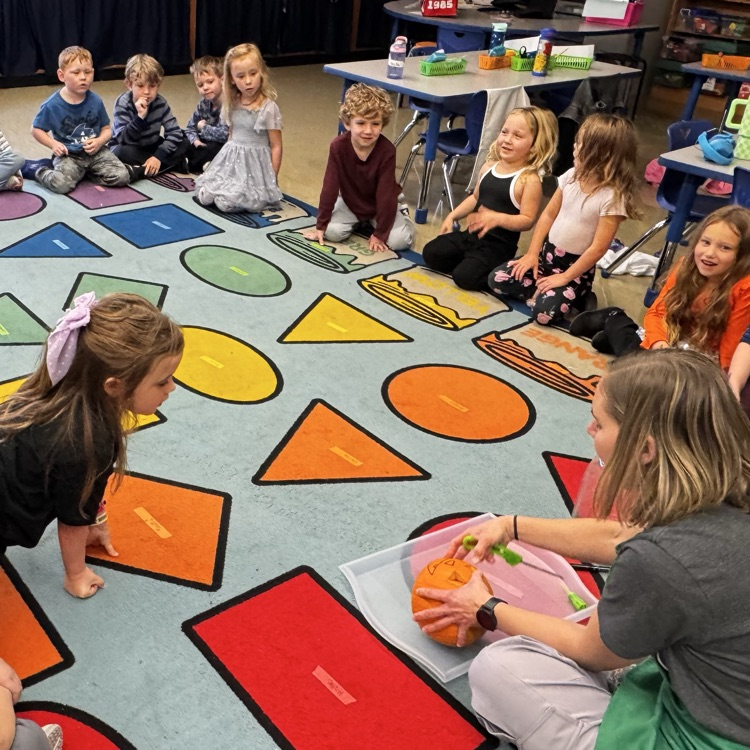 Kindergartners with a pumpkin 