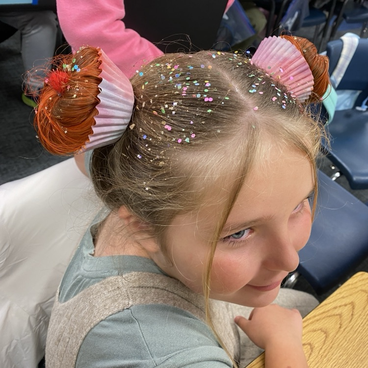 Students in hats and crazy hair.