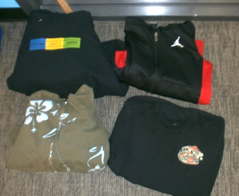 black jand red Jordan hooded jacket, black hoodie with blue/yellow/green squares, khaki/hawaiian print zip up hoodie, black hoodie