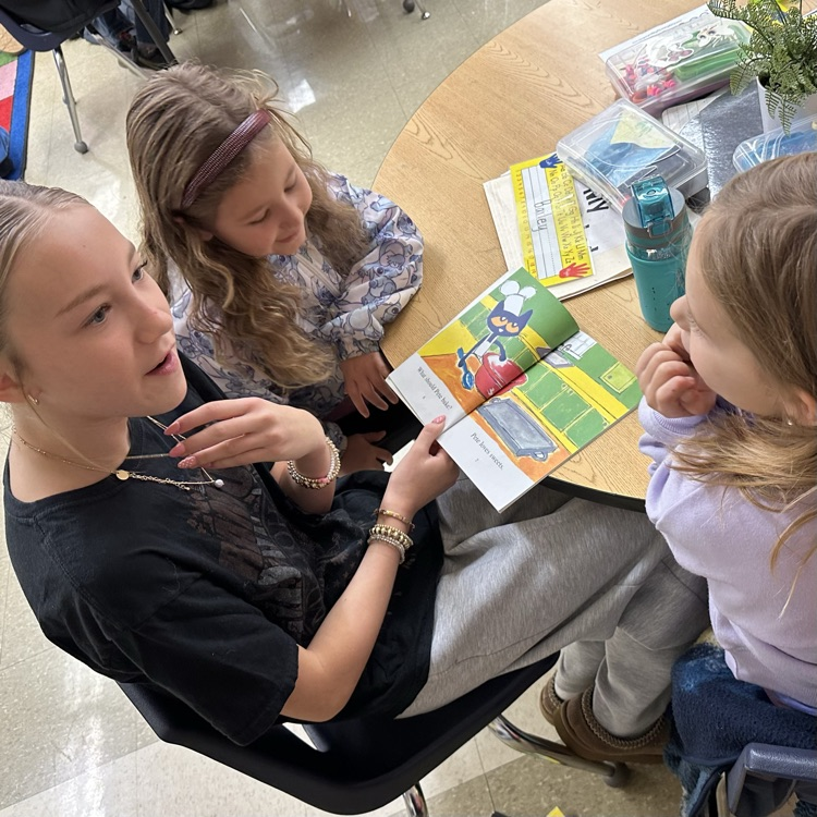 AVID readers read to young students .