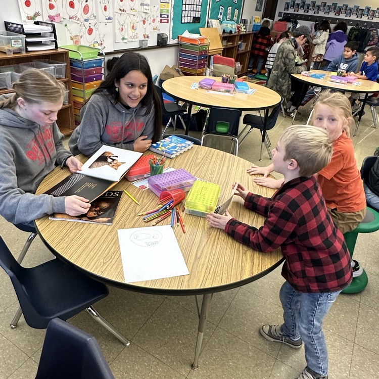 AVID readers read to young students.