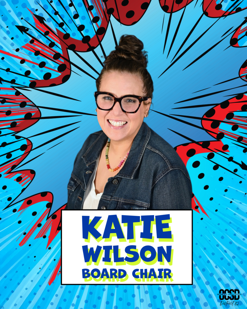 Portrait of Katie Wilson, Oregon City School District Board Chair, smiling and wearing glasses and a denim jacket, set against a blue comic-style background with red and black graphic accents. Text reads “Katie Wilson, Board Chair.”