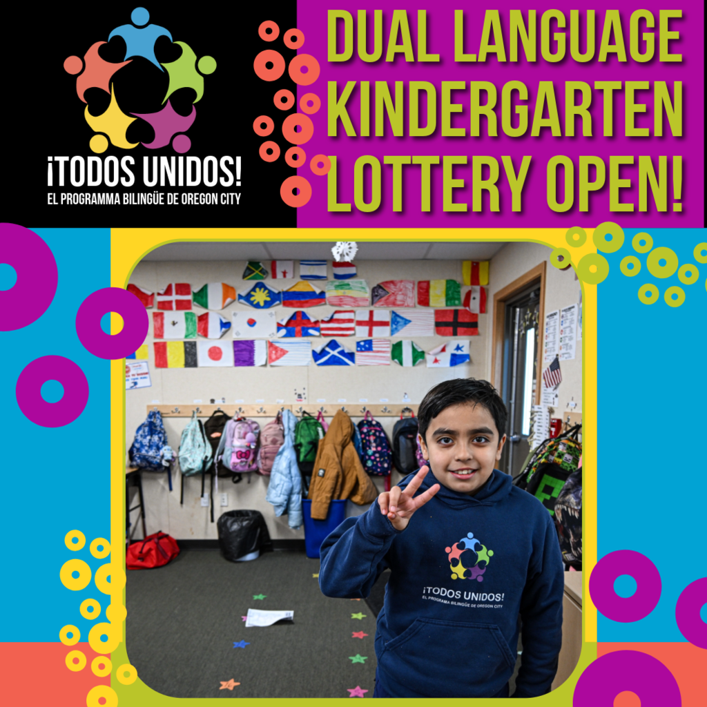 A vibrant, colorful graphic promoting the ¡Todos Unidos! Dual Language Kindergarten Lottery. In the upper left, the ¡Todos Unidos! logo — a circle of colorful figures — appears on a black background above the tagline "El Programa Bilingüe de Oregon City." Bold yellow-green text on a purple background reads "Dual Language Kindergarten Lottery Open!" The center photo shows a smiling young child wearing a navy ¡Todos Unidos! hoodie giving a peace sign, standing in a classroom hallway lined with backpacks and a wall covered in hand-drawn flags from countries around the world. The graphic background features bright teal, magenta, and orange with decorative circle patterns in yellow, purple, and green.